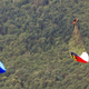 Illustration for article titled Tandem Paragliding Parachute Rips In Half During Stunt